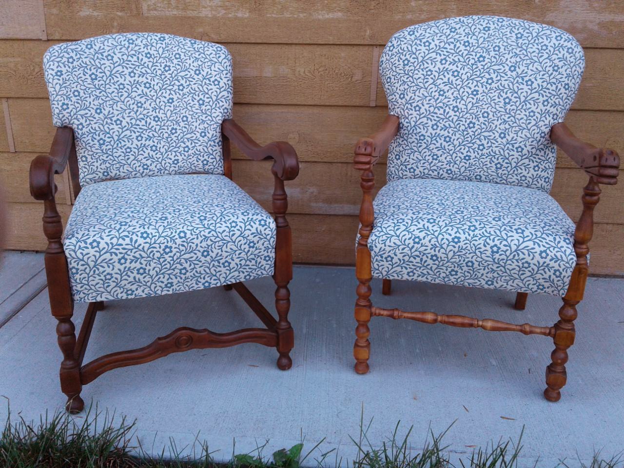Two wood frame armchairs with blue patterned upholstery