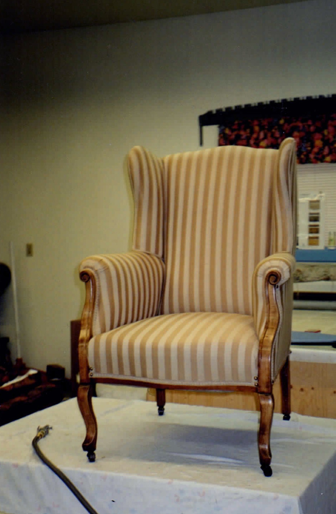 Striped armchair after reupholstery