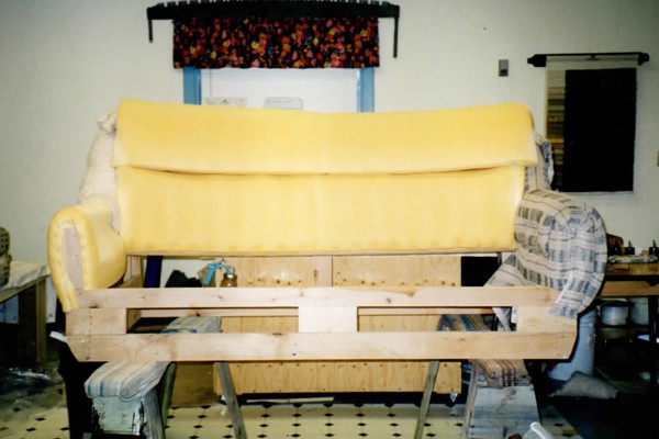 Plaid loveseat before reupholstery